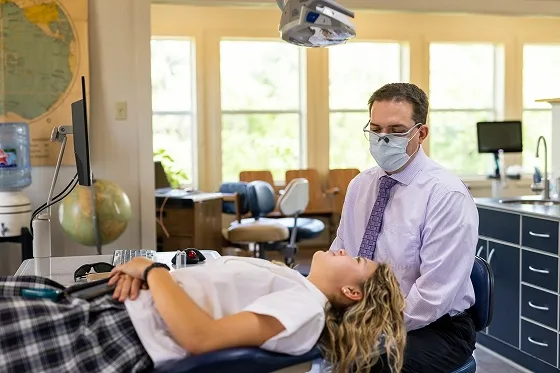 Dr. Hulme and a patient discuss treatment at our Boerne, TX office.