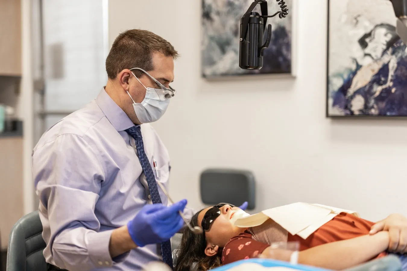 A patient undergoes an examination for TMJ treatment in San Antonio, TX