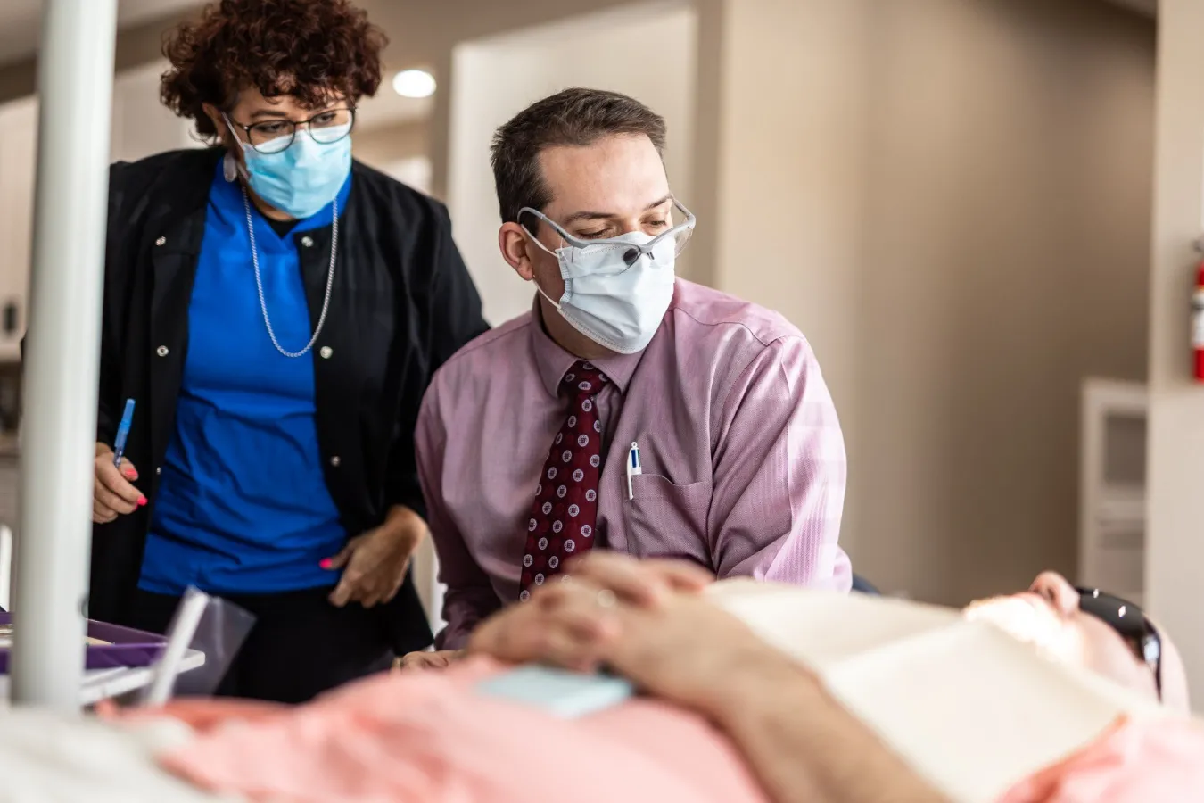 Our orthodontics team and a patient discuss possible orthognathic surgery options.