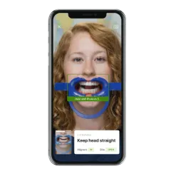 A patient undergoes a virtual consultation with Hulme Orthodontics.