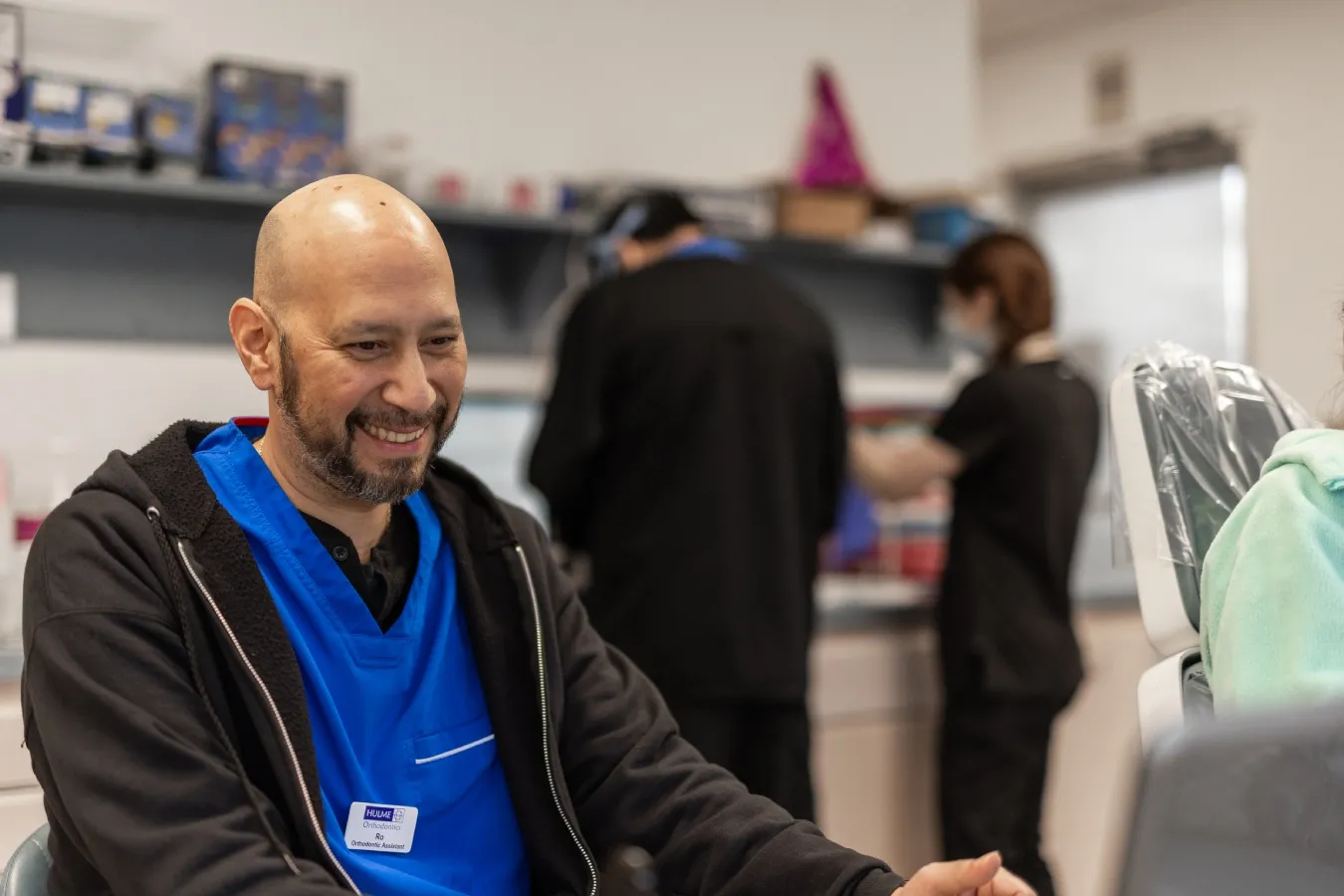 The orthodontics team at Hulme Orthodontics prepares to examine a patient.