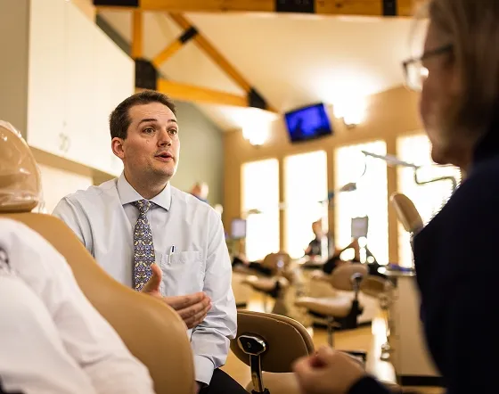 Dr. Hulme talks to a patient in San Antonio (Huebner Park), TX